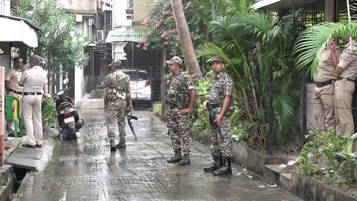 Representational image of security personnel guarding RG Kar Hospital victim's house, in Kolkata as CBI team visits, Monday, 19 August, 2024 | Credit: PTI