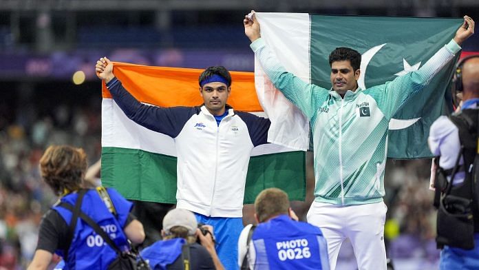 Gold medalist Pakistan's Arshad Nadeem and Silver medalist India's Neeraj Chopra celebrate after the men's javelin throw final at the 2024 Summer Olympics, in Paris, France on Thursday | PTI Photo/Ravi Choudhary