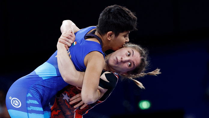 Paris 2024 Olympics - Wrestling - Women's Freestyle 53kg 1/8 Final - Champ de Mars Arena, Paris, France - 07 August, 2024. Antim Panghal of India in action with Zeynep Yetgil of Turkey | Reuters/Kim Kyung-Hoon