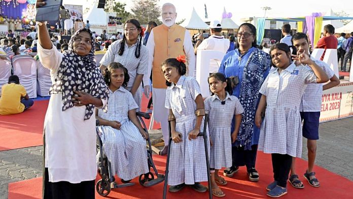 Specially-abled children pose for a selfie with a cutout of Prime Minister Narendra Modi during Divya Kala Mela 2023, at MMRDA Ground-1, Bandra Kurla Complex, in Mumbai, 17 February 2023 | ANI