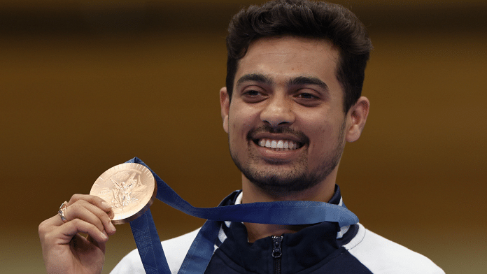 Shooter Swapnil Kusale with his bronze medal at the podium in Paris on Thursday | PTI