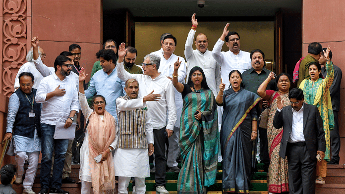 Opposition MPs protest against the disqualification of wrestler Vinesh Phogat, at Parliament in New Delhi on Wednesday | ANI