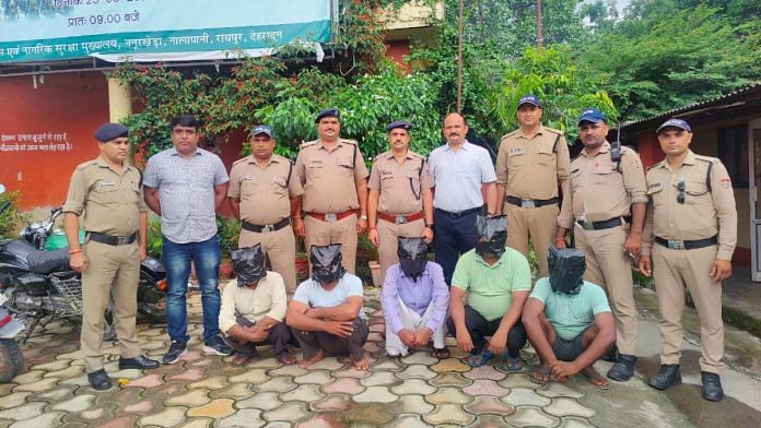 Dehradun police with the accused | By special arrangement