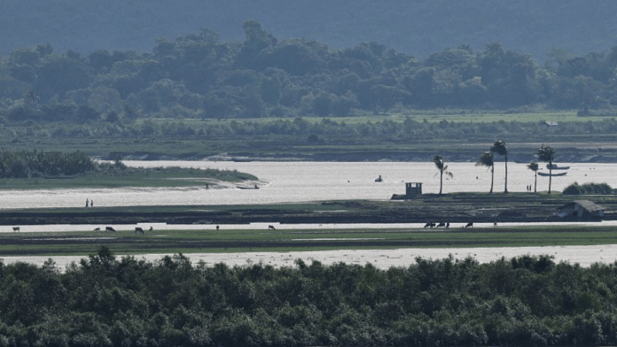 People of Maungdaw township of Myanmar are seen from the Teknaf area of Bangladesh, at the Myanmar-Bangladesh border | File Photo | Mohammad Ponir Hossain | Reuters |