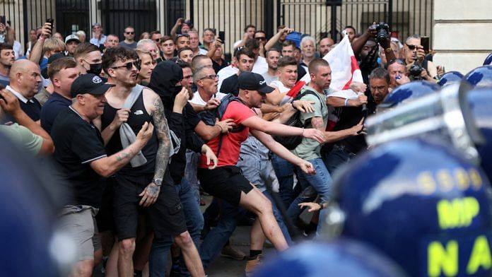 Police officers and demonstrators clash during a protest against illegal immigration, in London, Britain, July 31, 2024 | Reuters