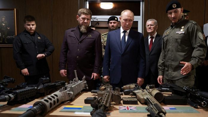 Russia's President Vladimir Putin and head of the Chechen Republic Ramzan Kadyrov look at weapons that were said to be captured during Russia's military campaign in Ukraine, as they visit the Russian Special Forces University in Gudermes, Russia August 20, 2024 | Pool via Reuters