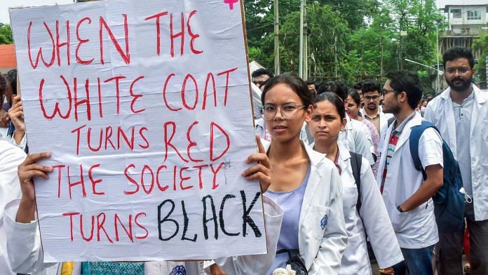 Resident doctors and students of Guwahati Medical College and Hospital hold posters as they protest against the alleged rape and murder case of Kolkata RG Kar Medical College, on Wednesday | ANI