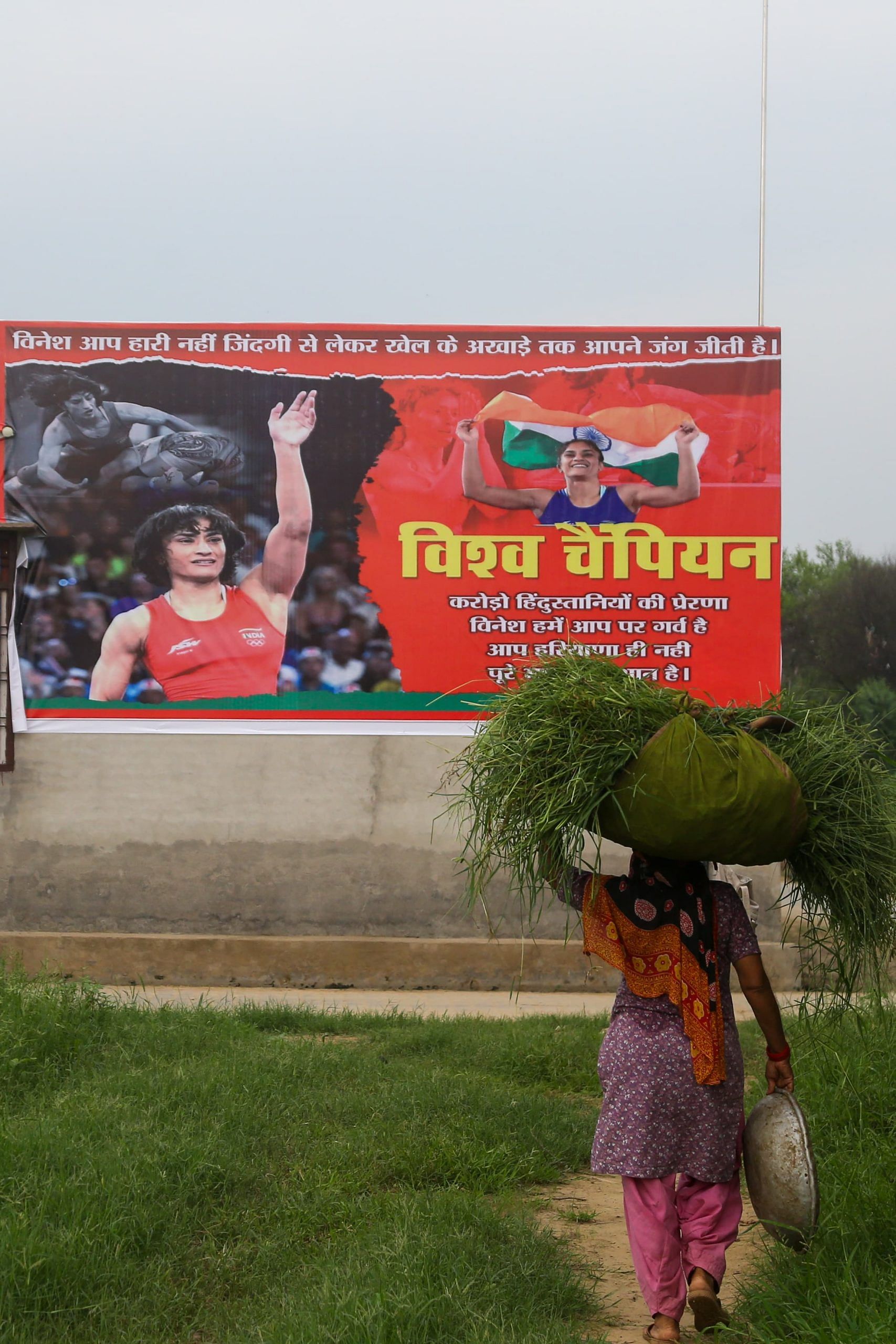 There are posters of welcoming Vinesh across the village | Photo: Suraj Singh Bisht| ThePrint