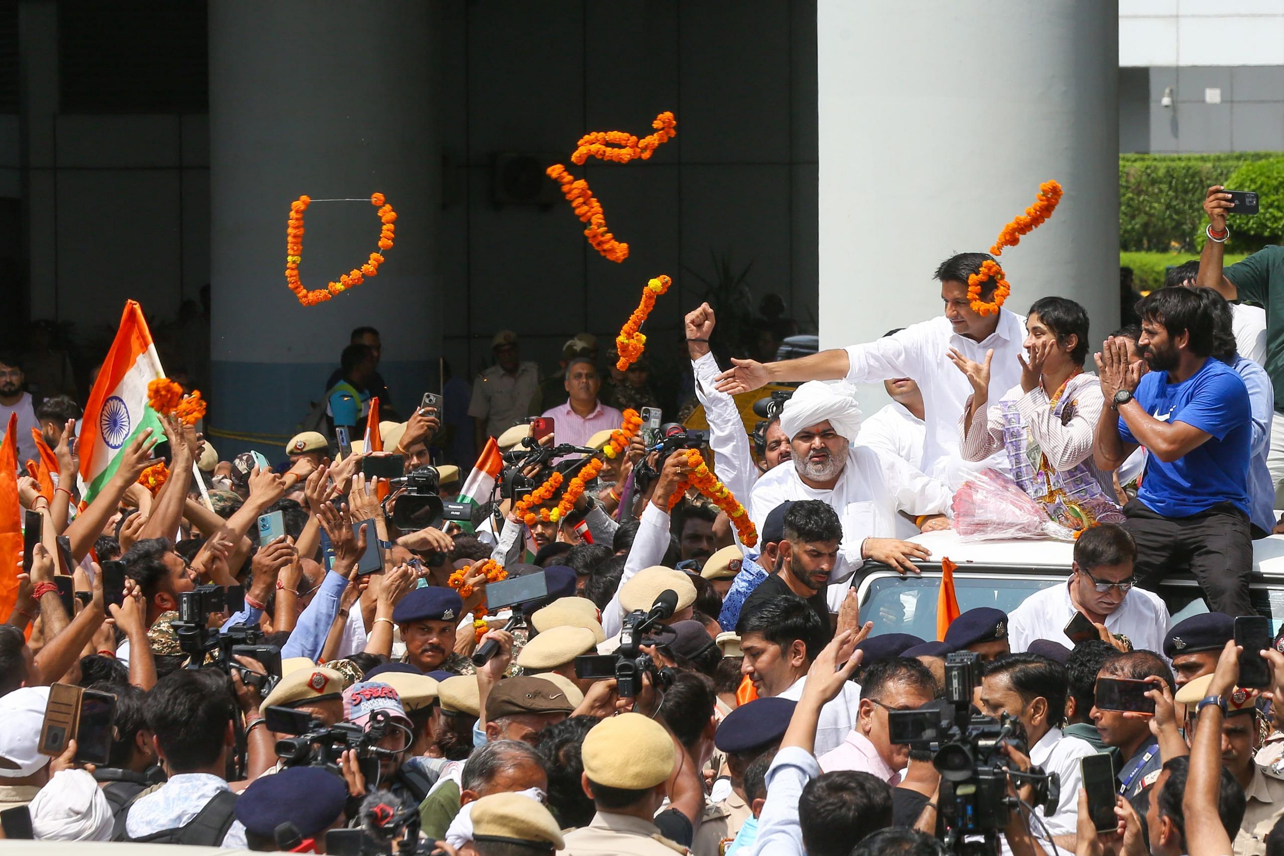 Garlands hurled at Vinesh at Delhi airport | Photo: Suraj Singh Bisht | ThePrint