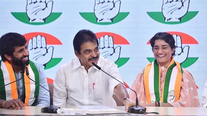 Wrestlers Bajrang Punia and Vinesh Phogat join Congress in the presence of party general secretary KC Venugopal in New Delhi on Friday | Photo: The Print