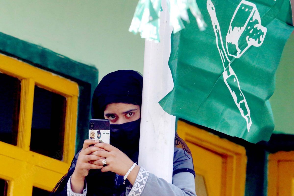 A girl taking a picture of Waheed ur Rehman Para during his campaign | Praveen Jain | ThePrint