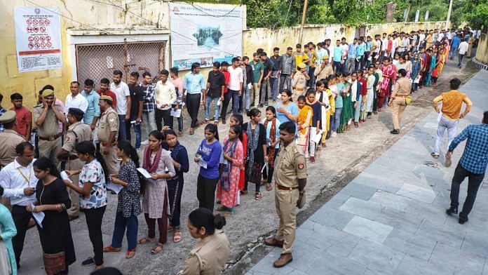 Candidates outside an exam centre for UP Police Constable recruitment exam in Lucknow, Friday | ANI