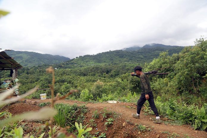 A Defence volunteer carrying a pumpi gun on his shoulder at Kangpokpi district | Photo: Suraj Singh Bisht | ThePrint