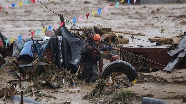 People being brought to safety from a flooded area in Nepal (File Photo/ANI)