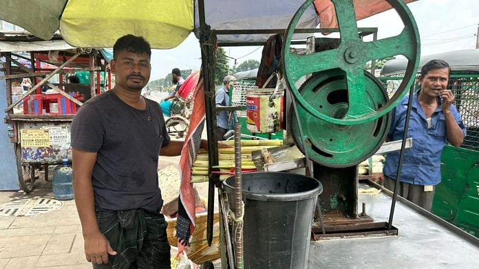 Akbar next to his juice cart in Dhaka. Several street vendors in the city are glad that the Sheikh Hasina-led government has been dissolved | Ananya Bhardwaj | ThePrint