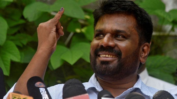 Anura Kumara Dissanayake, the presidential candidate from National People's Power, shows his ink-marked finger after casting his vote at a polling station on the day of the presidential election, in Colombo, Sri Lanka | Photo: REUTERS/Stringer