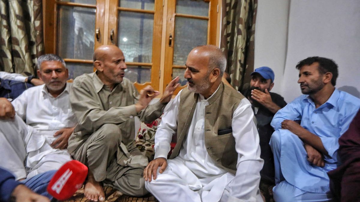 Rashid surrounded by his supporters at his residence in Srinagar. | Praveen Jain | ThePrint