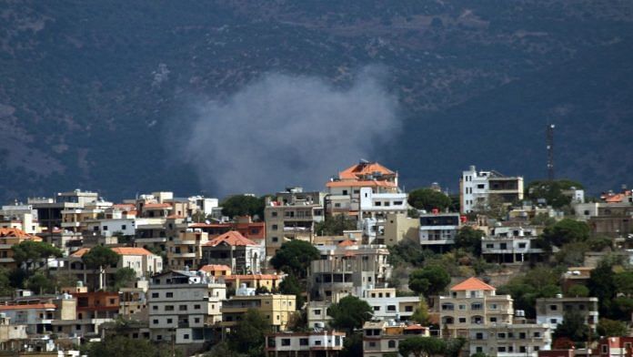 Smoke rises from the southern Lebanese village of Khiam, amid ongoing cross-border hostilities between Hezbollah and Israeli forces, as pictured from Marjayoun, near the border with Israel, September 20, 2024. REUTERS/Karamallah Daher