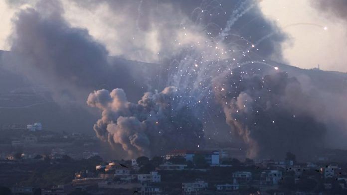 Smoke billows over southern Lebanon following Israeli strikes, amid ongoing cross-border hostilities between Hezbollah and Israeli forces, as seen from Tyre, southern Lebanon, 23 September 2024 | Reuters/Aziz Taher