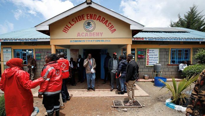 People gather at the Hillside Endarasha Academy, following a fatal fire which killed and injured several pupils, in Kieni, Nyeri County, Kenya on Friday | REUTERS/Monicah Mwangi