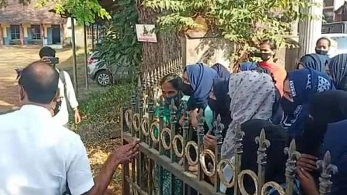 Students wearing the hijab are stopped from entering a college in Kundapur | Videograb