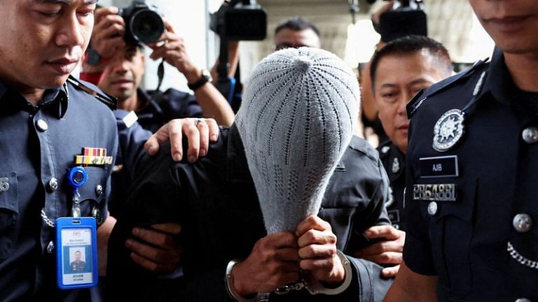 Malaysia charges man linked to Islamic firm in alleged child abuse scandal
