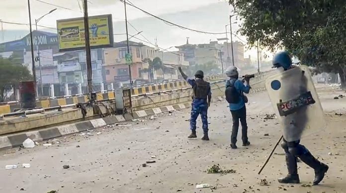 Security personnel during a clash with students who were protesting over recent violence, Imphal, Manipur on Tuesday | PTI