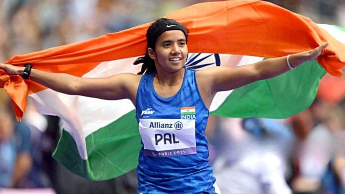 India's Preethi Pal holding the national flag celebrates her Bronze medal victory in the Women's 100m – T35 race, at the Paris Paralympics 2024 | Representational image | ANI
