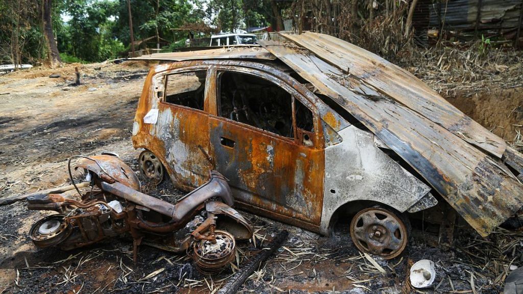 The charred remains of a car | Suraj Singh Bisht | ThePrint 