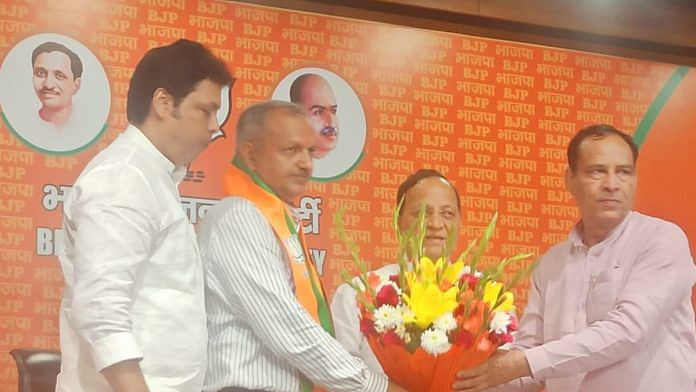 BJP’s incharge for Haryana Biplab Dev (extreme left) and state BJP president Mohan Lal Badoli (extreme right) inducting Sunil Sangwan to the BJP in Delhi | Special arrangement