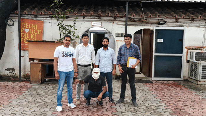 Police personnel with Assadullah Biswas, who was taking shelter at a hotel in Delhi’s Paharganj area | By Special Arrangement