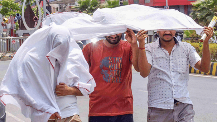 File photo of people shielding themselves from the scorching sun | ANI