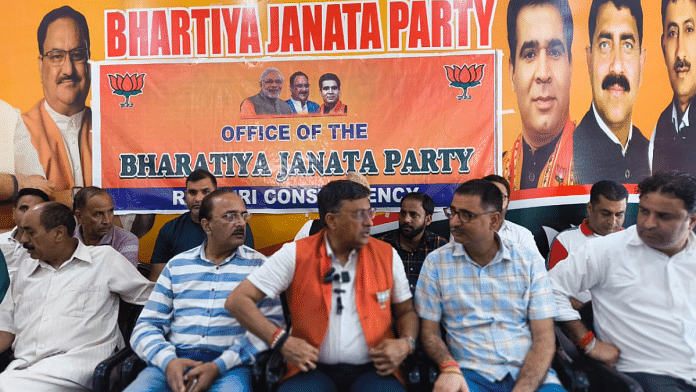 BJP's Rajouri candidate Vibodh Gupta (in saffron jacket) at the party office in Rajouri ahead of the polls | Sourav Roy Barman | ThePrint