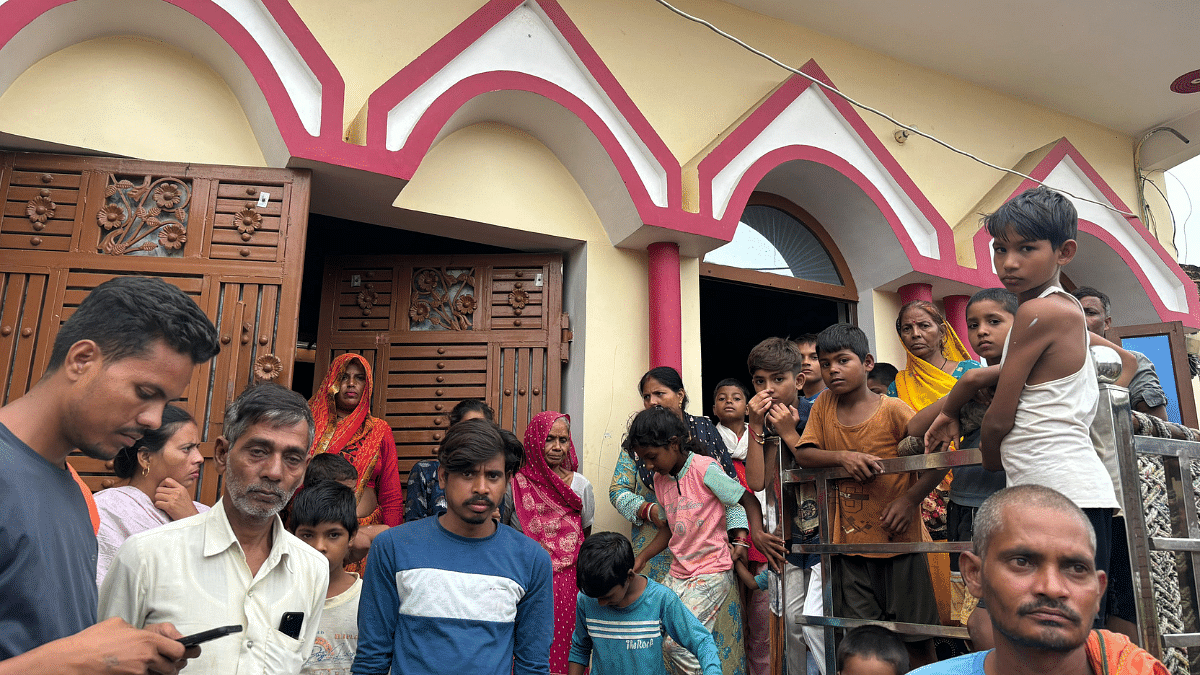 Villagers outside the house of a boy who claimed that one of the accused, Jashodhan Singh alias Bhagat, had earlier attempted to strangle him | Bismee Taskin | ThePrint