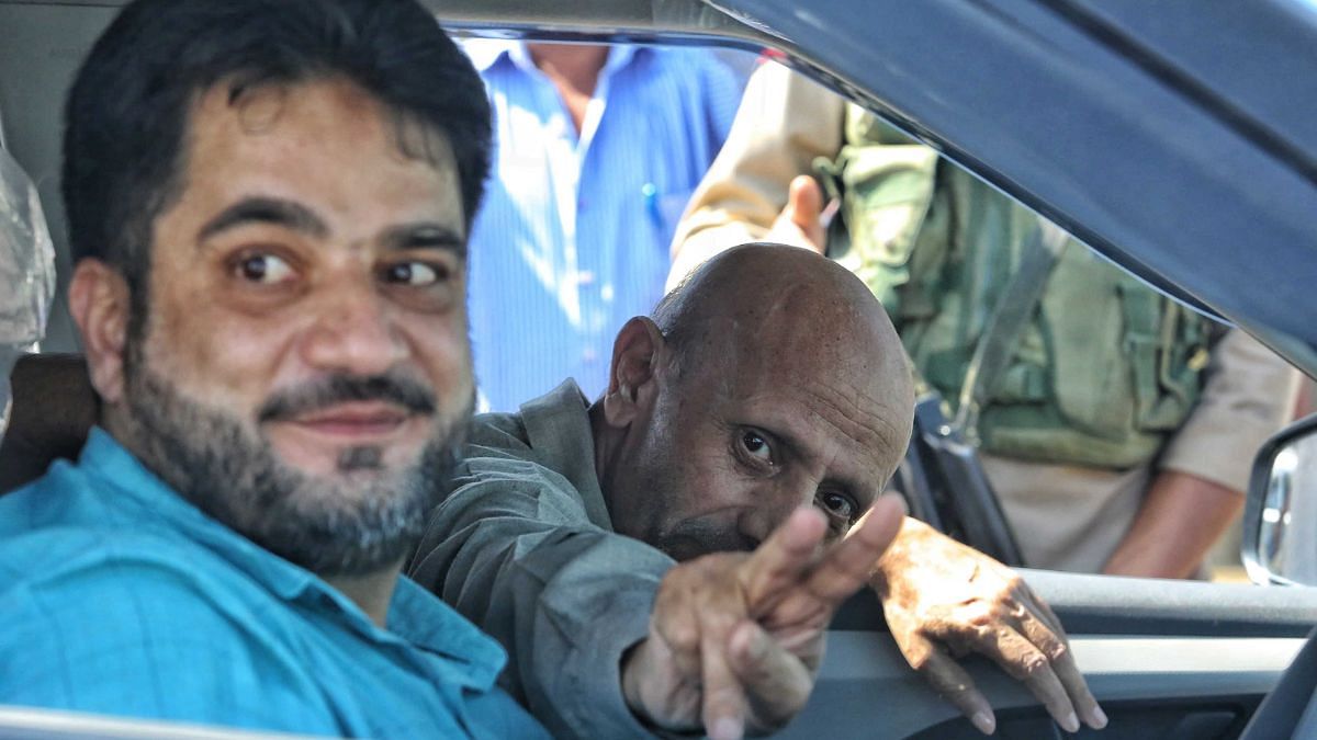 Baramulla MP Engineer Rashid flashes the victory sign at the camera | Praveen Jain | ThePrint Photo