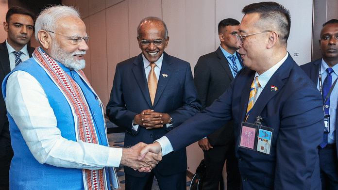 Prime Minister Narendra Modi being welcomed on his arrival at the Changi Airport, as Singapore Minister of Home Affairs and Law K Shanmugam looks on, in Tanah Merah | Photo: ANI