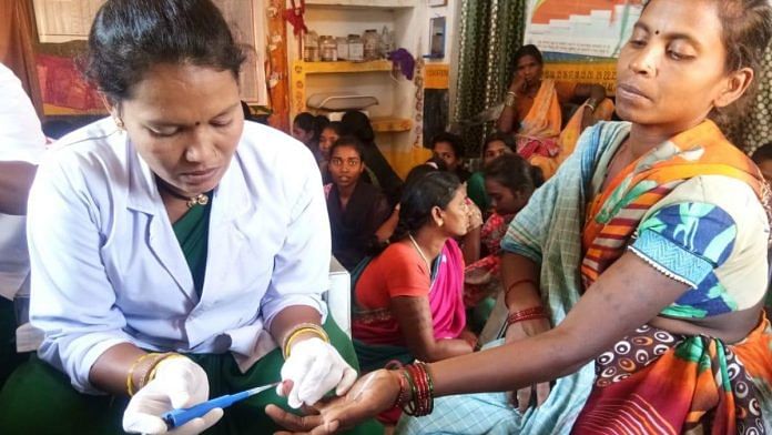 A woman being tested for iron during 'Lalima - Loha Le Anaemia Se' campaign to improve women's health in India.