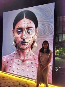 CGI artist Madhu with her artwork The Priest