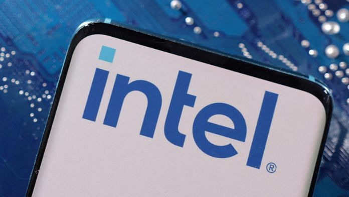 A smartphone with a displayed Intel logo is placed on a computer motherboard in this illustration taken March 6, 2023 | Reuters file photo