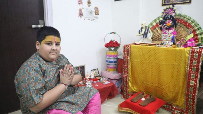 Krishna bhakt Abhinav Arora with one of his idols in his puja room