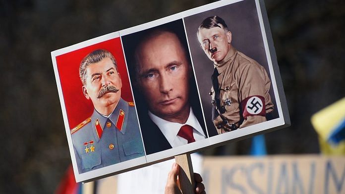 Placard showing Putin, Stalin, Hitler