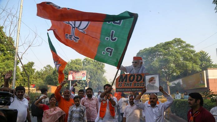 BJP workers celebrating Haryana win at party HQ in New Delhi on 8 October | Suraj Singh Bisht | ThePrint