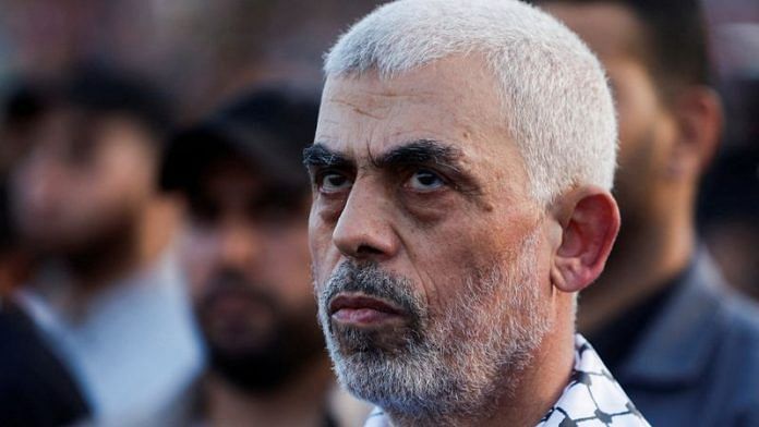 Hamas leader Yahya Sinwar looks on as Palestinian Hamas supporters take part in an anti-Israel rally over tension in Jerusalem's Al-Aqsa mosque, in Gaza City October 1, 2022. REUTERS/Mohammed Salem/File Photo