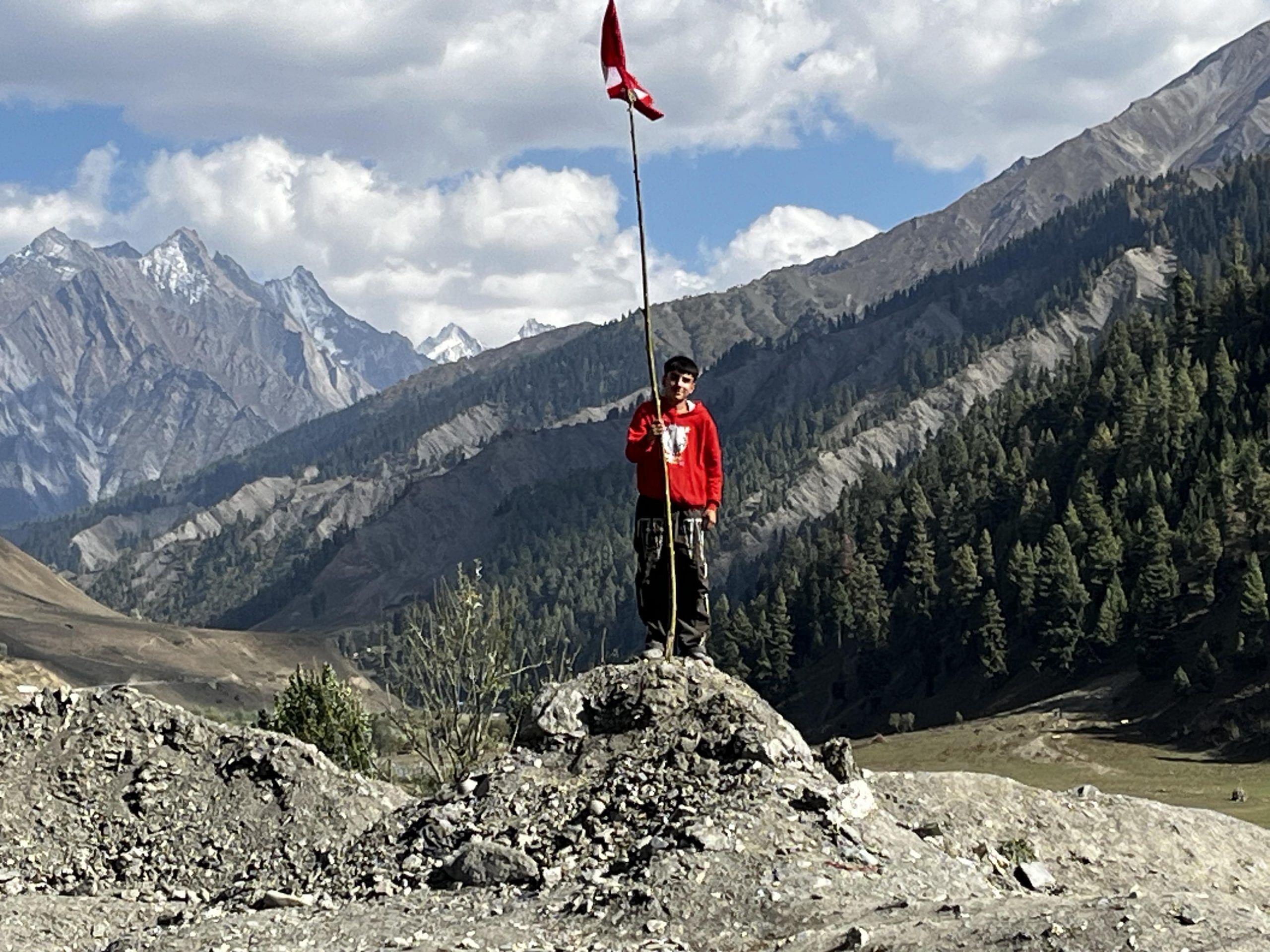 A young man waves a National Conference flag in the village of Sarad Aab. | Praveen Swami | ThePrint