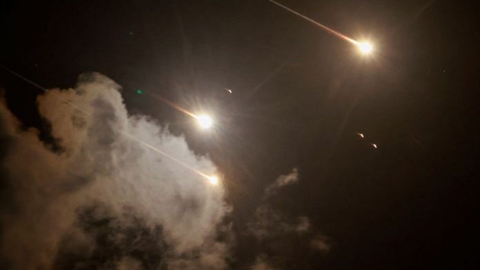 Projectiles seen in the sky after Iran fired a salvo of ballistic missiles, amid cross-border hostilities between Hezbollah and Israel, as seen from Tel Aviv, Israel, 1 October, 2024 | REUTERS/Ammar Awad