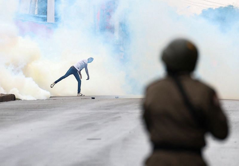 Mozambique police clash with opposition protesters after disputed