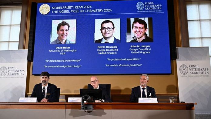 Announcers of the laureates for the Nobel Prize in Chemistry, Johan Aqvist, Hans Ellegren and Heiner Linke, look on as the images of the winners, David Baker (University of Washington, USA), Demis Hassabis (Google DeepMind, UK) and John M Jumper (Google DeepMind, UK) are displayed, in Stockholm, Sweden October 9, 2024. TT News Agency/Christine Olsson via REUTERS