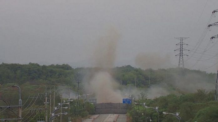 Smoke rises after North Korea blows up sections of inter-Korean roads on its side of the border between the two Koreas, according to South Korea's military, as seen from the South Korean side, October 15, 2024, in this screen grab from a handout video. South Korean Defence Ministry/Handout via REUTERS/File Photo