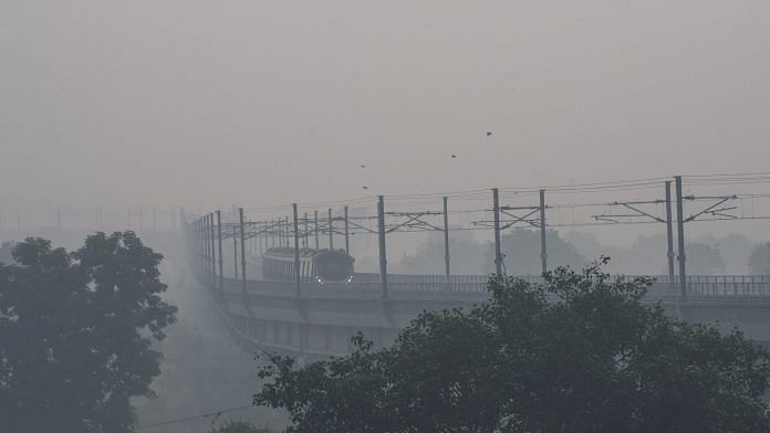 A metro train runs on its track amid smog, in New Delhi, Tuesday | PTI Photo/Atul Yadav