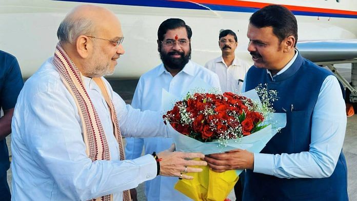 Maharashtra deputy chief minister Devendra Fadnavis warmly welcomes Union home minister Amit Shah (left) upon his arrival in Mumbai last month. Chief Minister Eknath Shinde is also seen | Photo: ANI